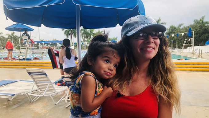 A young girl and her mom thankful for the help from lifeguards A young girl and her mom thankful for the help from lifeguards