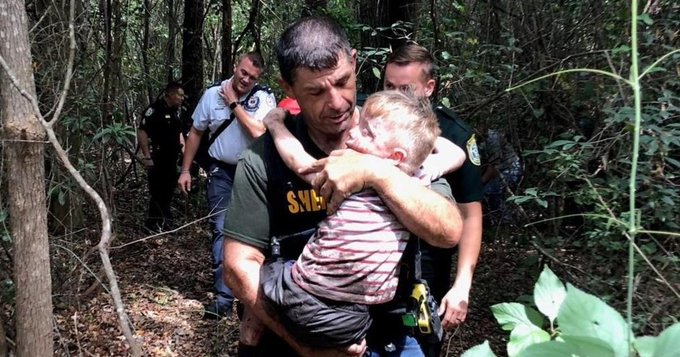 Deputy Lenzo carrying Aedric Hughes from a wooded area in FL Deputy Lenzo carrying Aedric Hughes from a wooded area in FL