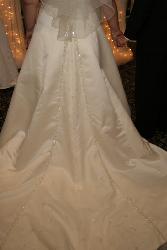 My wedding gown - This is one of my favorite pics from our special day. This is the back of my Maggie Sottero bridal gown.