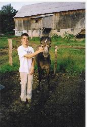 My son and his horse Kharouf - This is my son on his cousin's farm with his horse Kharouf, a pure blooded Arabian mare.