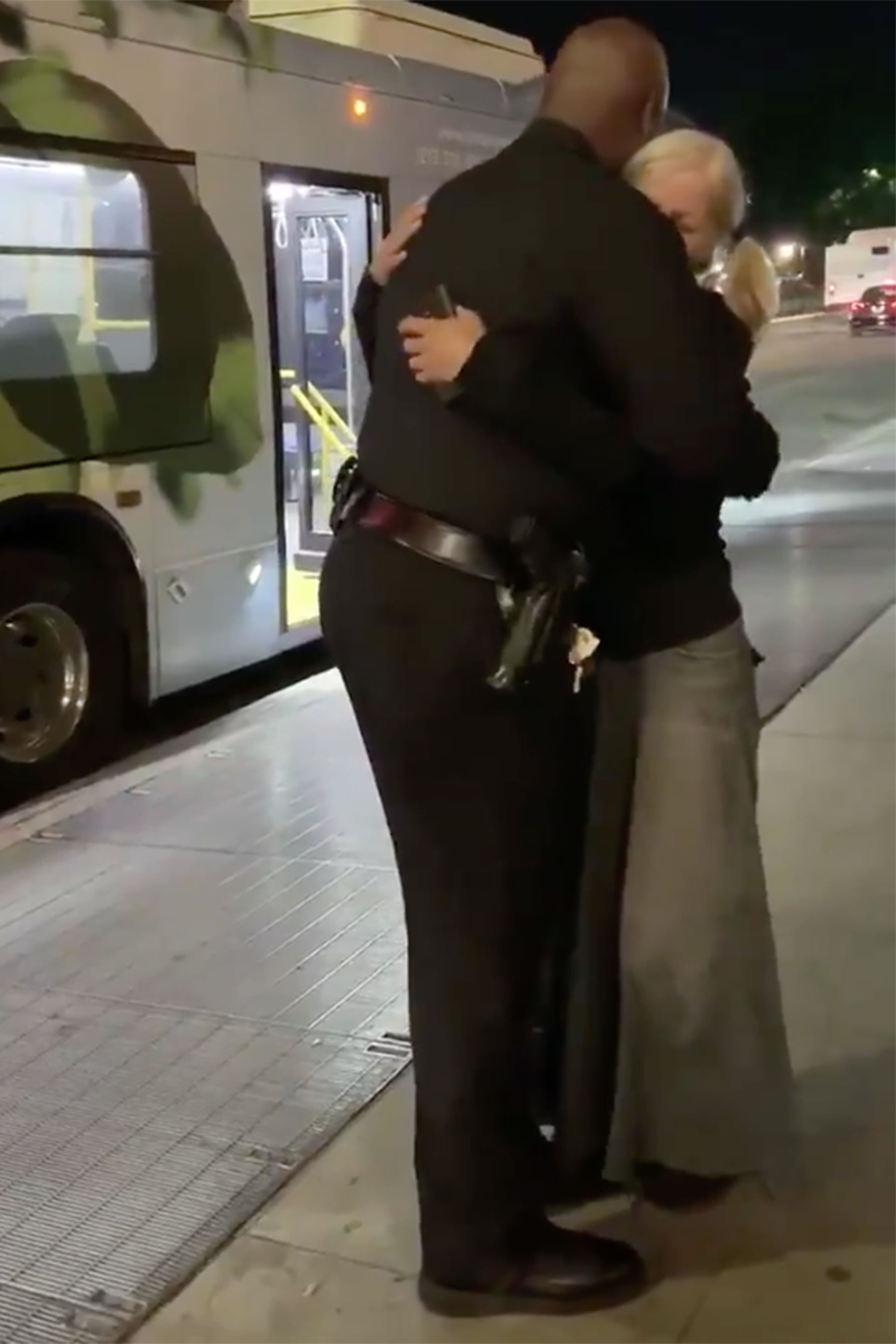 LAPD Officer Thomas hugs Emily Zamourka LAPD Officer Thomas hugs Emily Zamourka