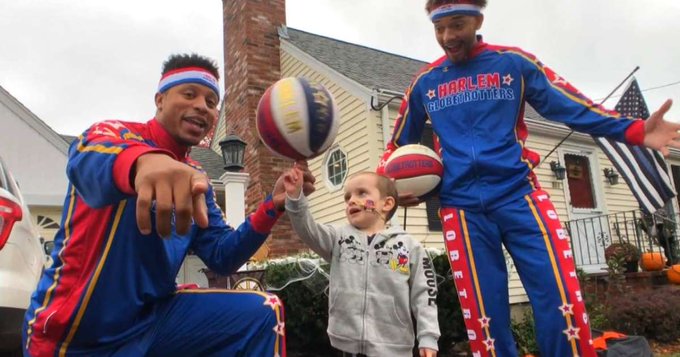 Quinn Waters and two members of the Harlem Globetrotters Quinn Waters and two members of the Harlem Globetrotters