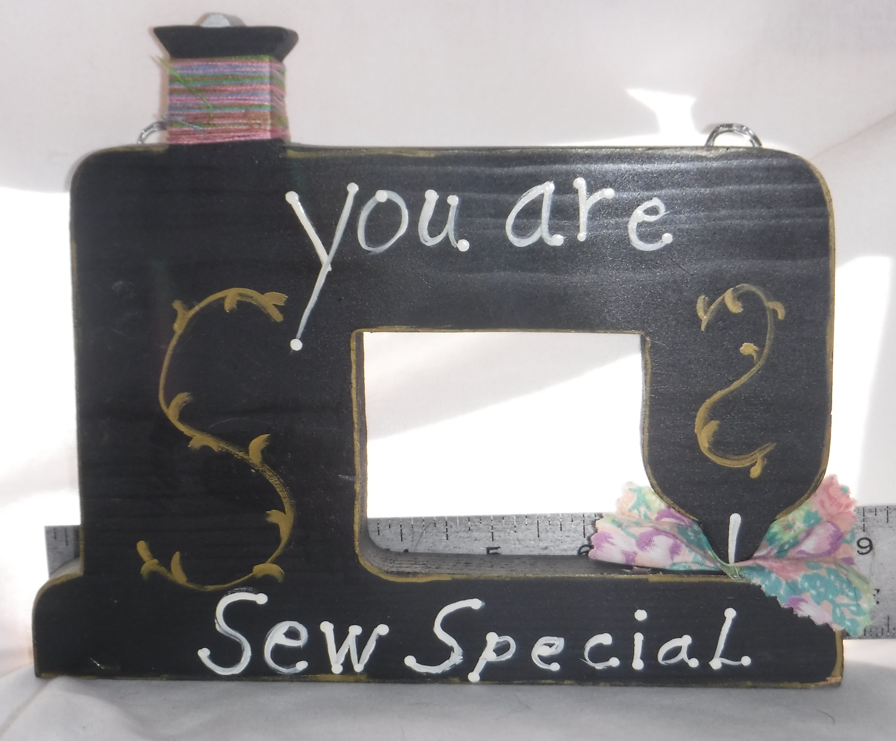 Photo I took of the sewing machine decoration for eBay Photo I took of the sewing machine decoration for eBay