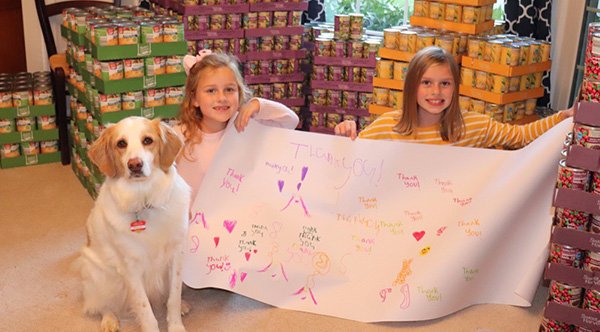 Charlotte and her sister Alex Fischer doing their part to assist the needy Charlotte and her sister Alex Fischer doing their part to assist the needy