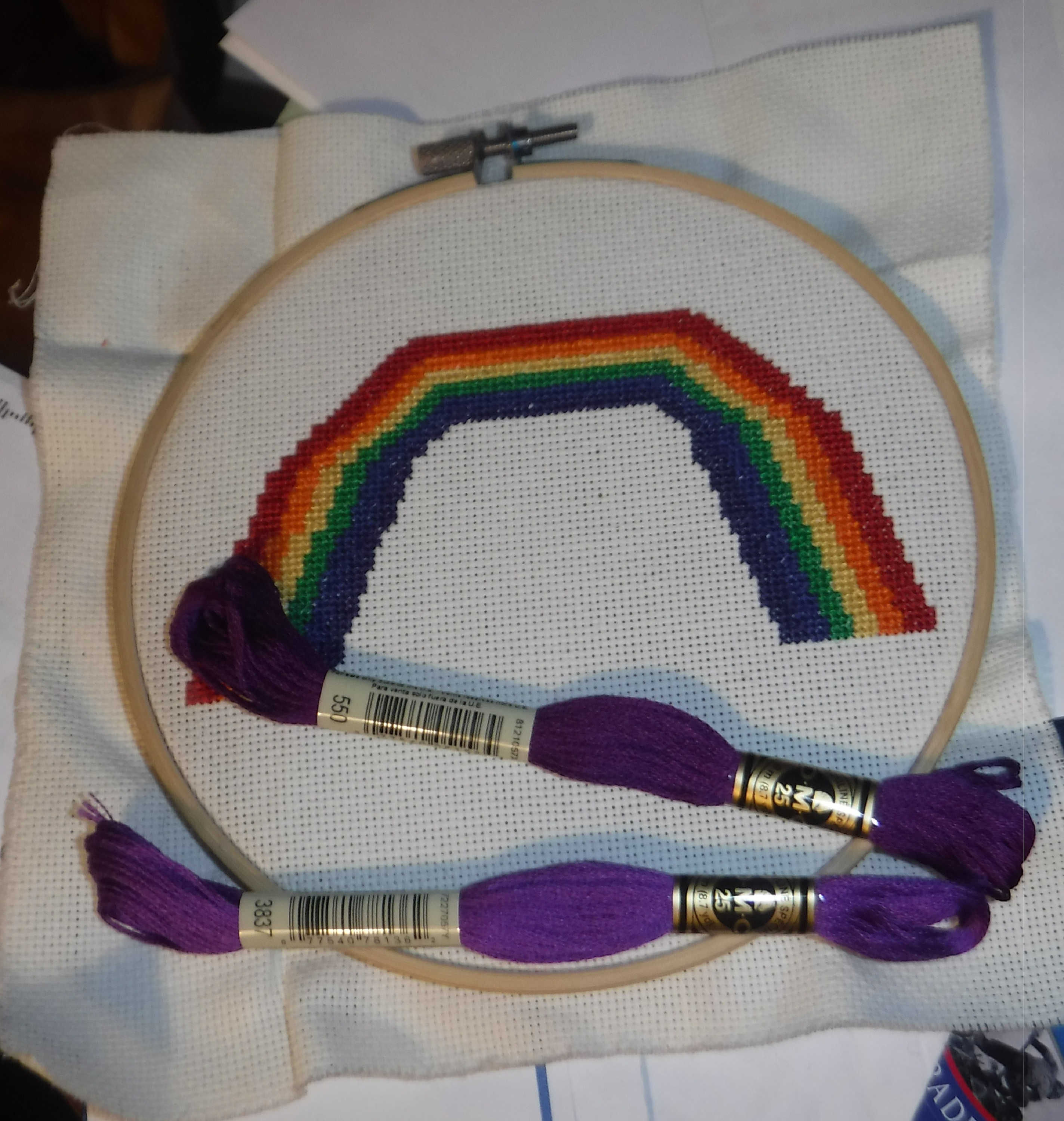 Photo taken by me of my cross stitch with two purple floss skeins I ordered Photo taken by me of my cross stitch with two purple floss skeins I ordered