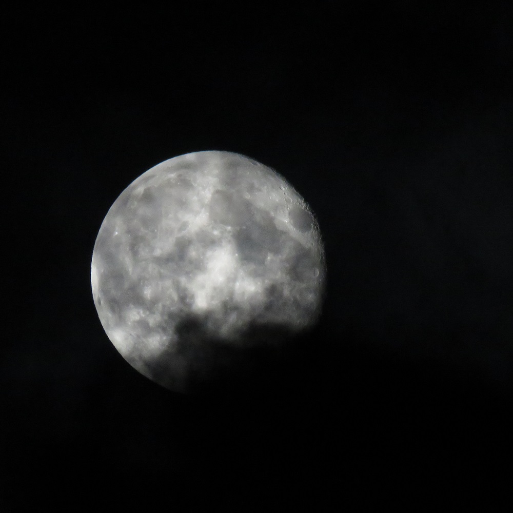 Photo I just took of the moon, with a little bit of clouds starting to move in.