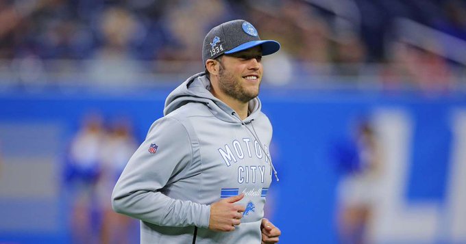 Detroit Lions quarterback Matthew Stafford meets two of his young fans