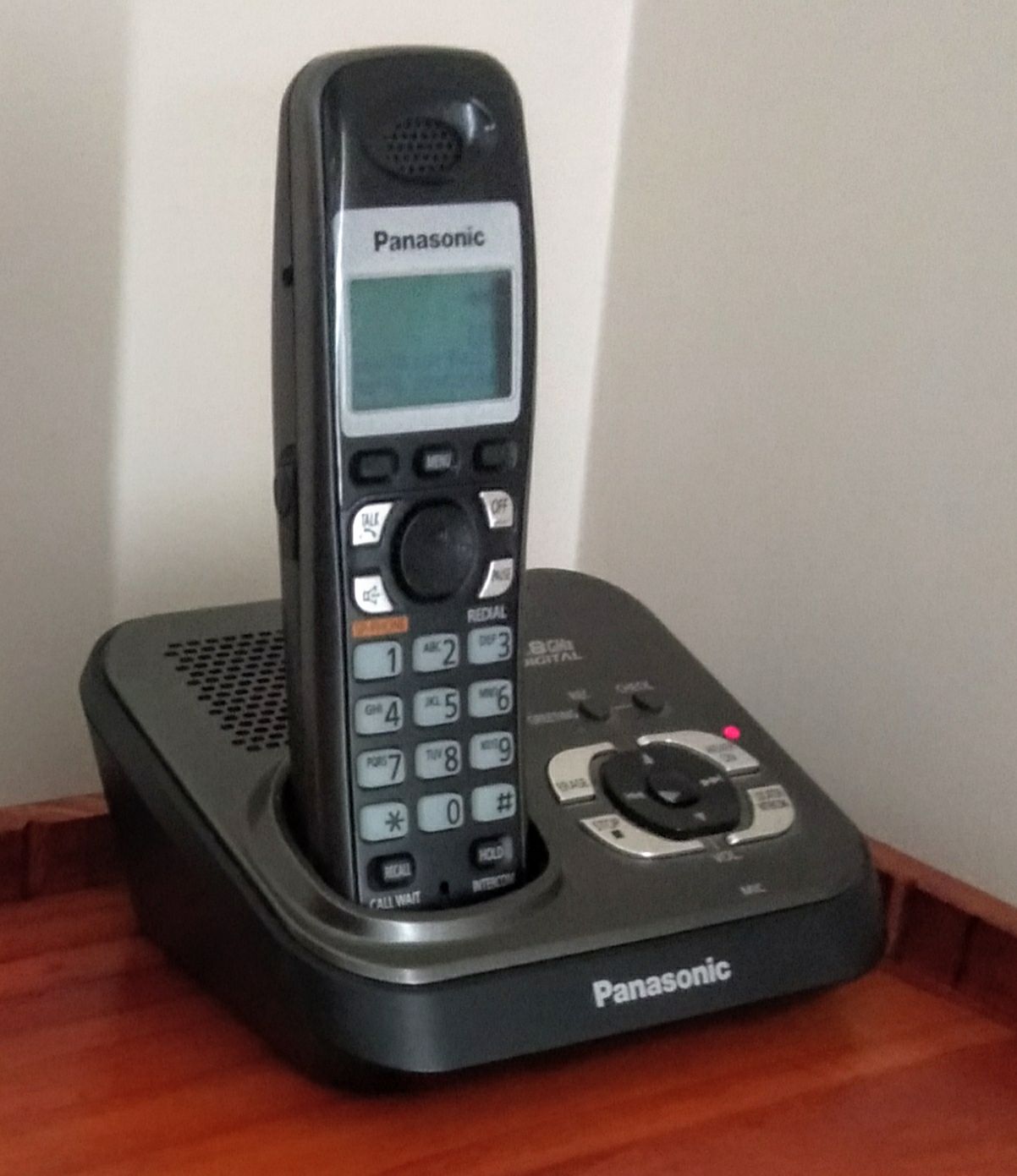 Johns home phone hidden away in a corner in his study