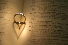love - A ring on the book,its shadow  likes heart!