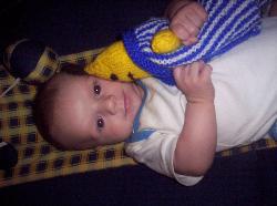 Kai, my beautiful son... - Heres a pic of my beautiful five month old baby boy Kai and his favoutite toy in the world a knitted Bananas in Pyjamas doll that his Nana, my mum, gave him. He adores it and is always bashing it up which is why we have aptly nicknamed it Bam Bam...LOL