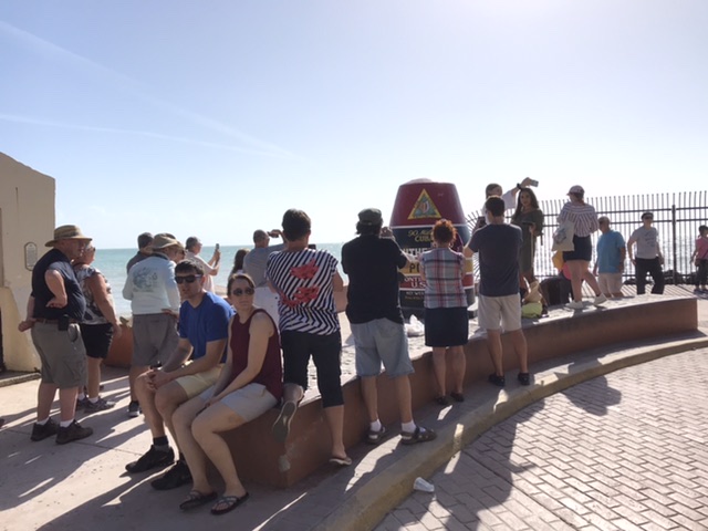 People lined up to snap a photo at the Southernmost Point buoy.  Photo taken by and the property of FourWalls.