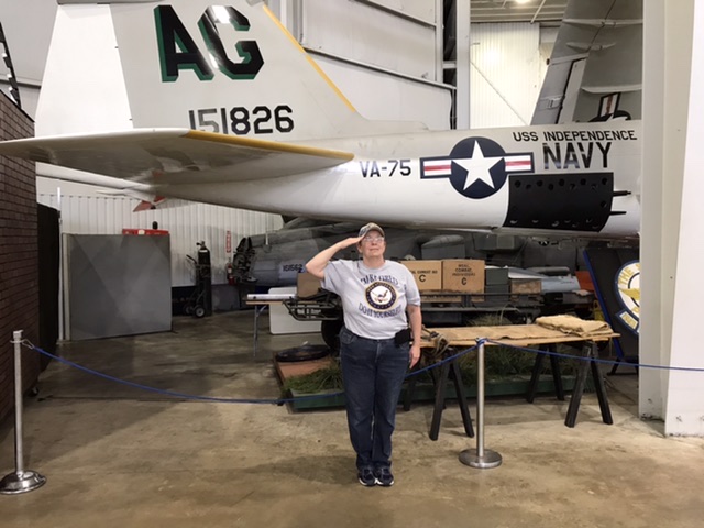 A fellow tourist took this photo of me giving a salute to my brother in front of a plane from his final Navy squadron. Photo the property of FourWalls. A fellow tourist took this photo of me giving a salute to my brother in front of a plane from his final Navy squadron. Photo the property of FourWalls.