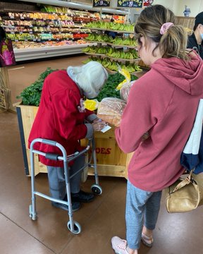 Elderly lady meets a young girl who is offering to do her shopping for her Elderly lady meets a young girl who is offering to do her shopping for her