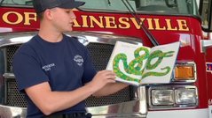 A Gainesviile Florida firefighter reads a children's book that will be seen on Facebook A Gainesviile Florida firefighter reads a children's book that will be seen on Facebook