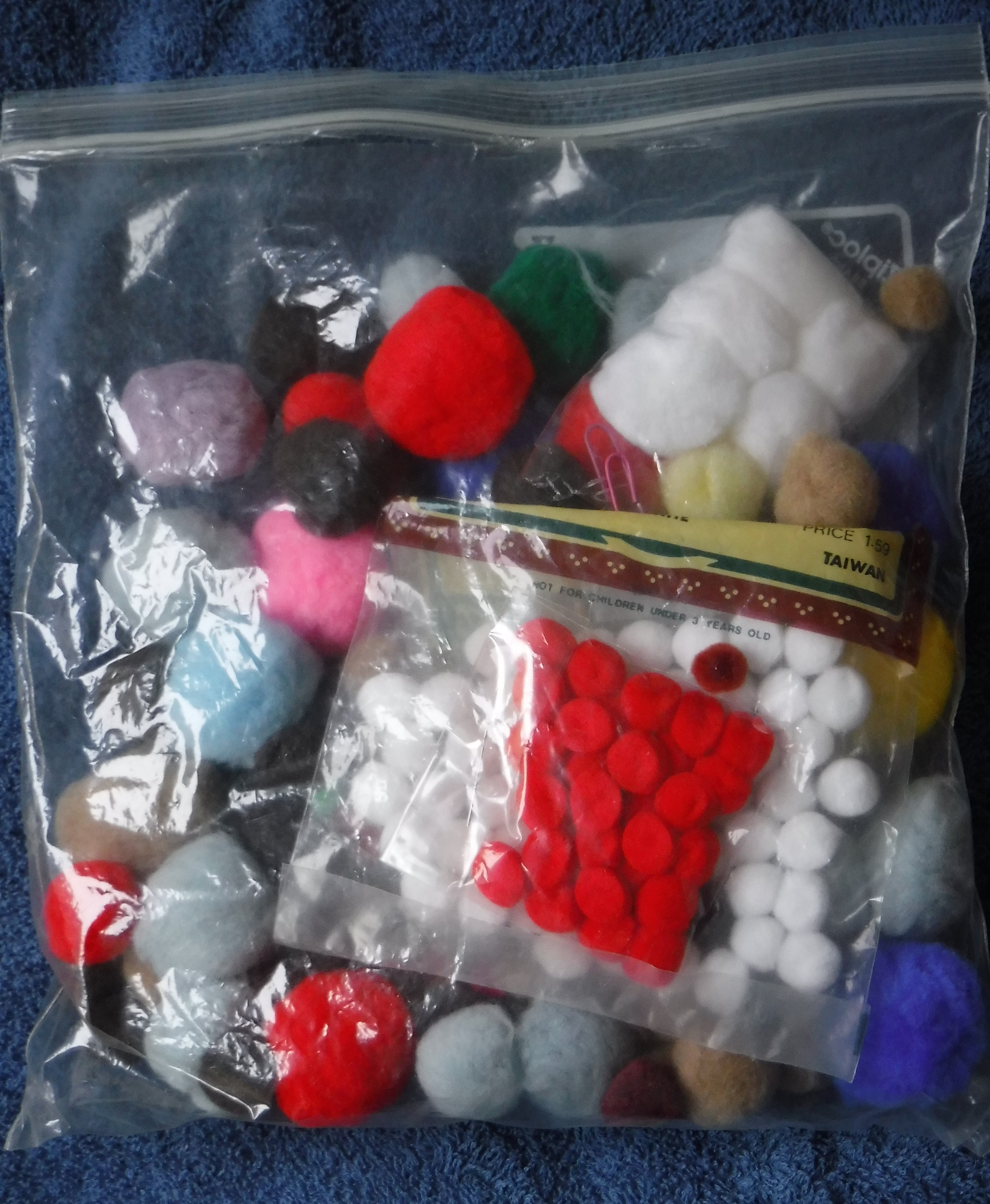 One of the photos I took of the bag of pom poms. One of the photos I took of the bag of pom poms.