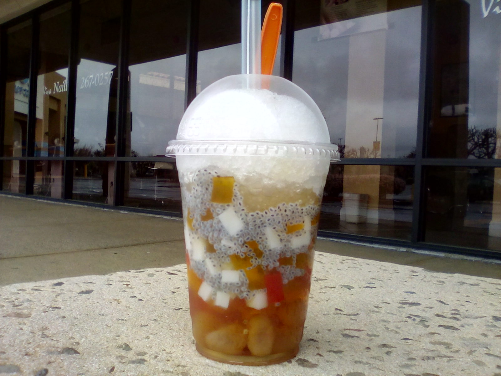 Vietnamese dessert, with a straw, lychee, fruit,ice Vietnamese dessert, with a straw, lychee, fruit,ice
