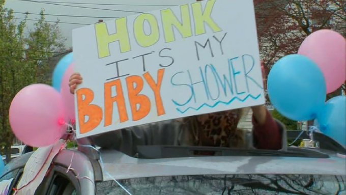 A sign that is promoting a baby shower in Long Island New York