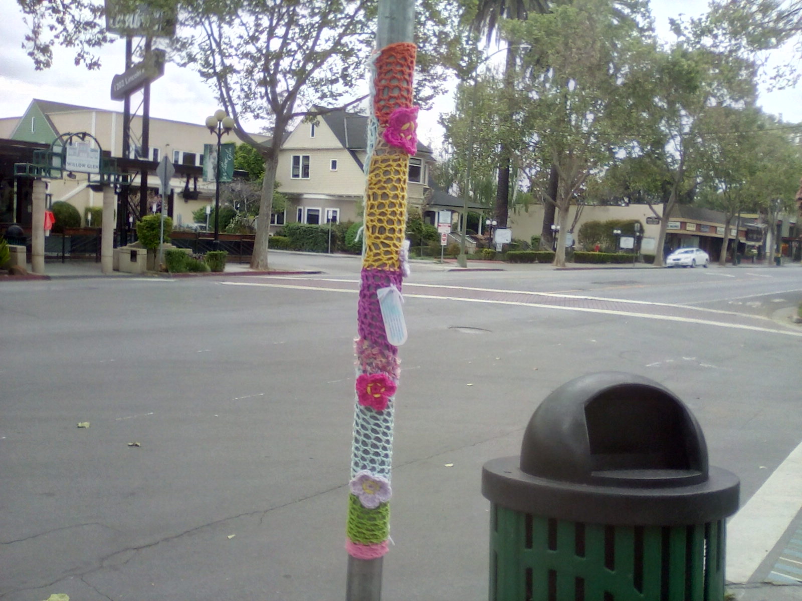Crochet, yarn, crochet flower, pole wrappedvwith crochet, dtreet ary in willow glen Crochet, yarn, crochet flower, pole wrappedvwith crochet, dtreet ary in willow glen