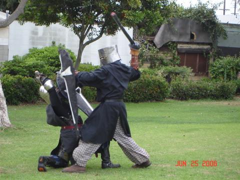 Press - Another SCA picture, here I've legged my friend Mike and am pressing him to make him loose focus. You also put the shield infront of your enemy so they can't see to fight.
