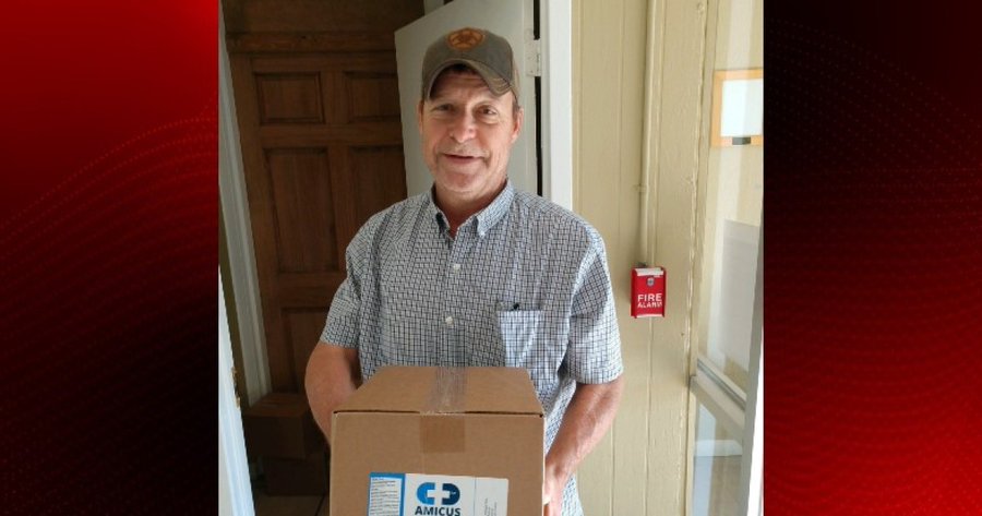 Dwayne Breaux with a box of hand sanitizer that was donated to the Rayne Police Dwayne Breaux with a box of hand sanitizer that was donated to the Rayne Police