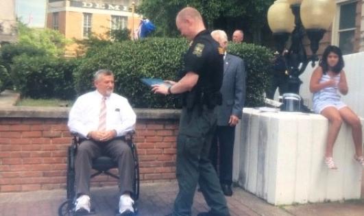 Judge Charles Smith (seated) rewards his hero Deputy Upchurch