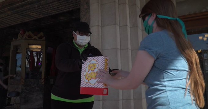 A customer getting popcorn at the Pickwick Theater in Illlinois A customer getting popcorn at the Pickwick Theater in Illlinois