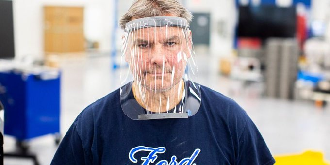 A Ford employee wearing a face shield A Ford employee wearing a face shield