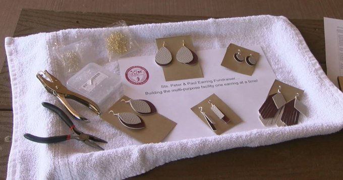 Pairs of leather earrings displayed for sale Pairs of leather earrings displayed for sale