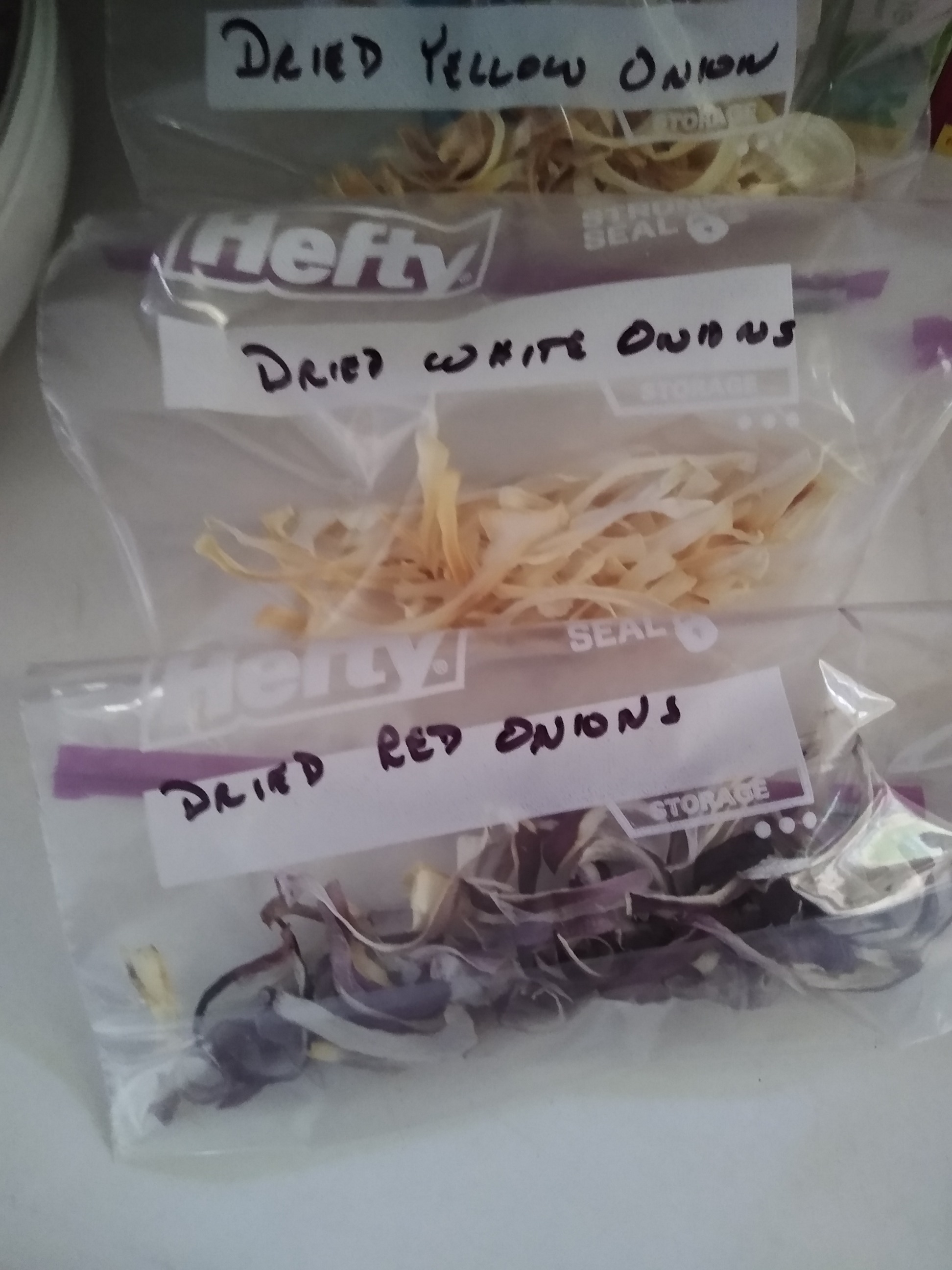 Dried red, white and yellow onions. Photo is mine.