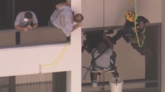 Firefighters rescue a window washer in Florida Firefighters rescue a window washer in Florida