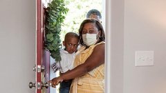 Cerone and her children are seen with former NFL star Warrick Dunn