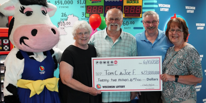 Tom Cook and his family with their lottery winnings Tom Cook and his family with their lottery winnings