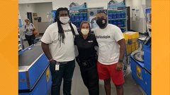 Two happy Wal Mart customers and a security guard with a heart of gold Two happy Wal Mart customers and a security guard with a heart of gold