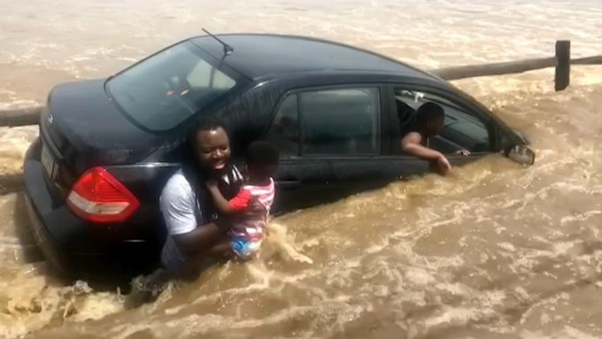 A dad with one of his children that were rescued by Good Samaritans A dad with one of his children that were rescued by Good Samaritans