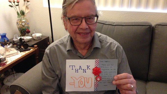A senior citizen with a kind card from a teen in California
