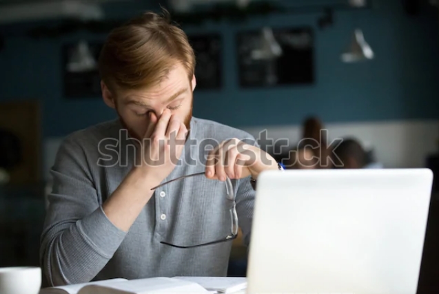 fizkes image of man with eye strain via shutterstock