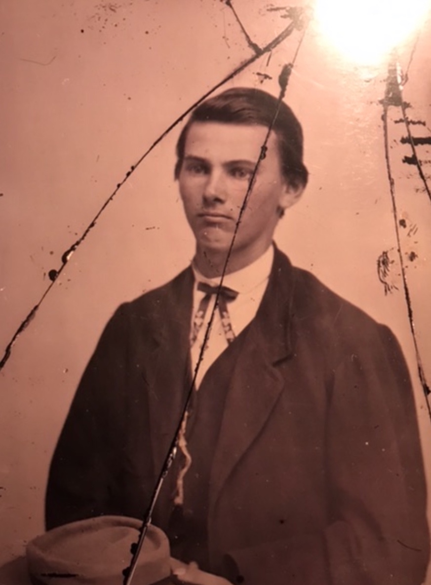 Photo (over 150 years old, so obviously not in great shape) of Jesse James on display at the Jesse James Farm in Kearney, Missouri.  Photo taken by and the property of FourWalls.