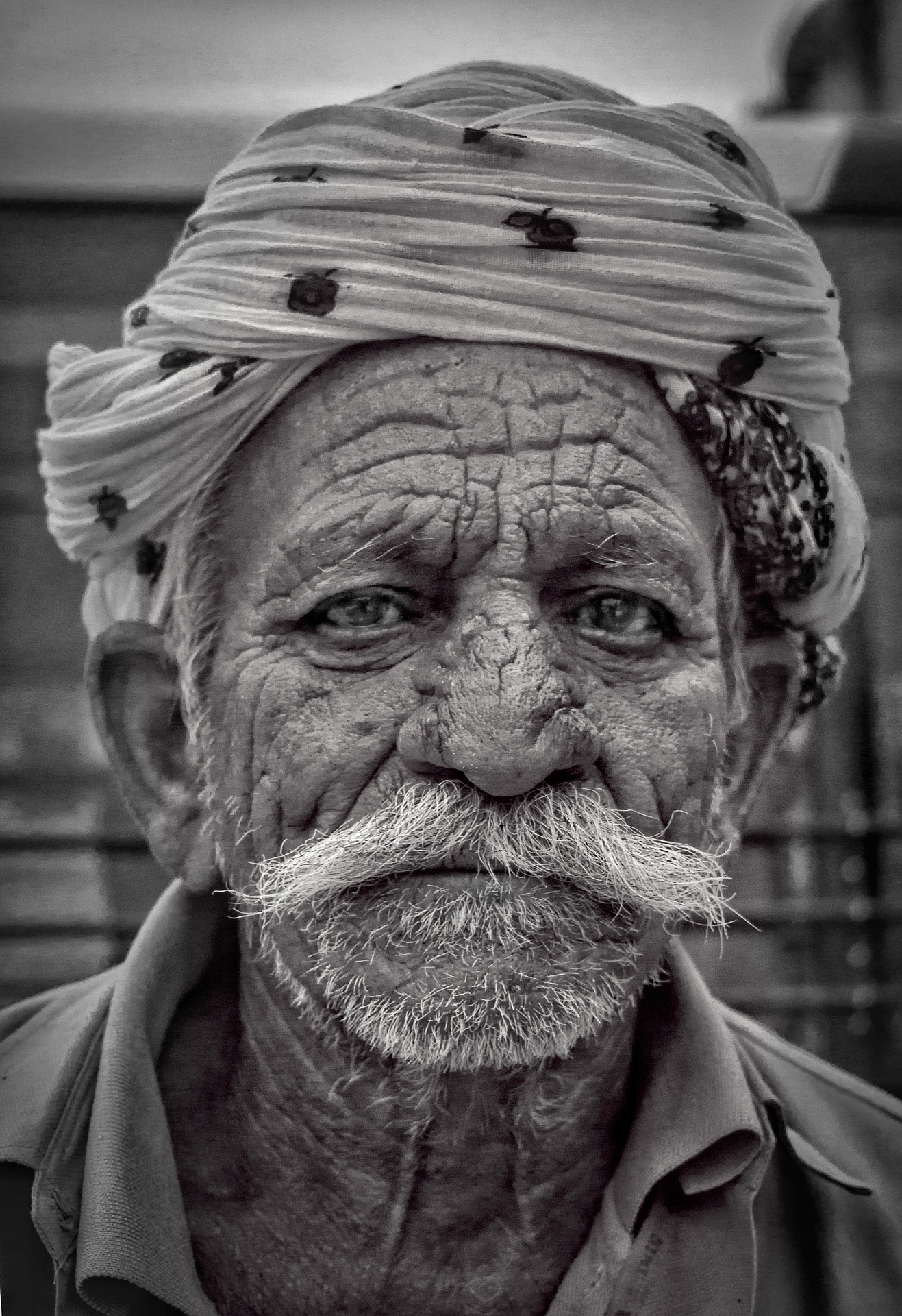 The father in law seemed to be permanently attached to his turban The father in law seemed to be permanently attached to his turban