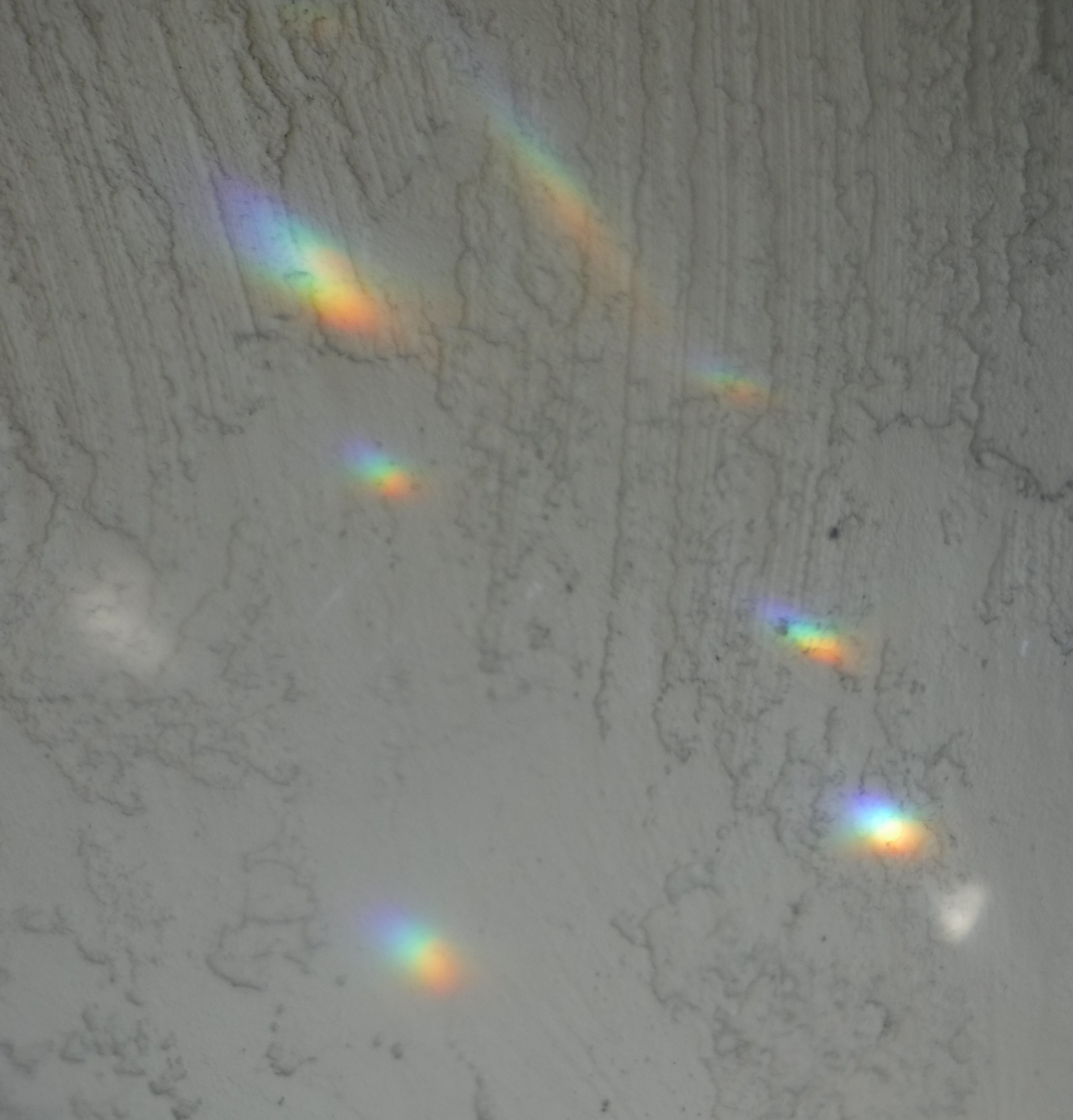 Photo I took of a reflection outside on the wall from the door handle Photo I took of a reflection outside on the wall from the door handle