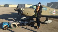 Pilot Edward Seitan and a dog getting ready to be going to a foster home Pilot Edward Seitan and a dog getting ready to be going to a foster home