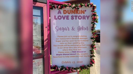 A sign in the drive in window at Dunkin' in Oklahoma City A sign in the drive in window at Dunkin' in Oklahoma City