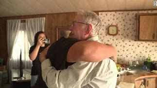 Papa John's delivery driver Derlin Newey hugs Carlos Valdez Papa John's delivery driver Derlin Newey hugs Carlos Valdez