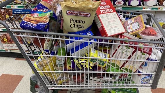 A grocery cart filled with food in New Hampshire