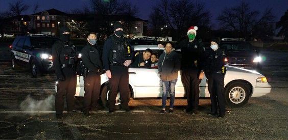 Overland Park Police with the Rosario family and their replacement auto Overland Park Police with the Rosario family and their replacement auto