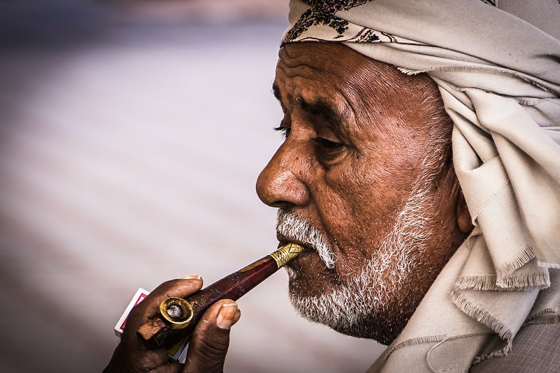  The Mullah, puffing away, unawarely, on his pipe too.