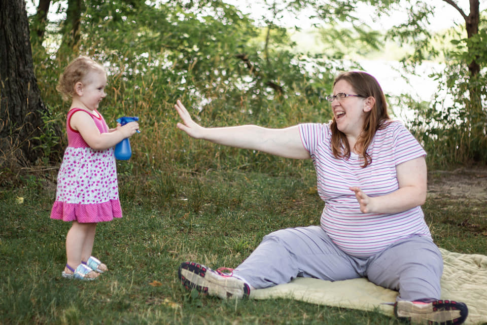 Picture with one of my daughters while pregnant with my son.