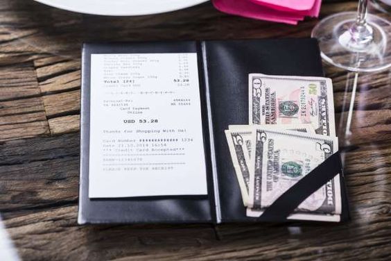 An anonymous customer gives a huge tip to employees at a restaurant An anonymous customer gives a huge tip to employees at a restaurant