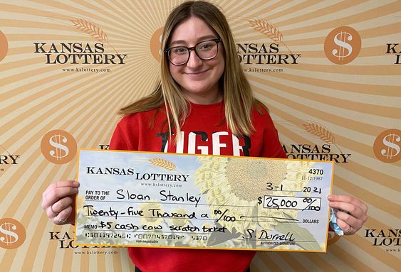 Kansas Lottery winner Sloan Stanley with her cash prize