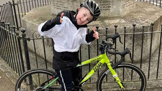 Eight year old child Rhys Stevens and his bicycle Eight year old child Rhys Stevens and his bicycle