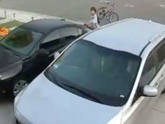 A young boy riding a bike returning a lost purse to its owner A young boy riding a bike returning a lost purse to its owner